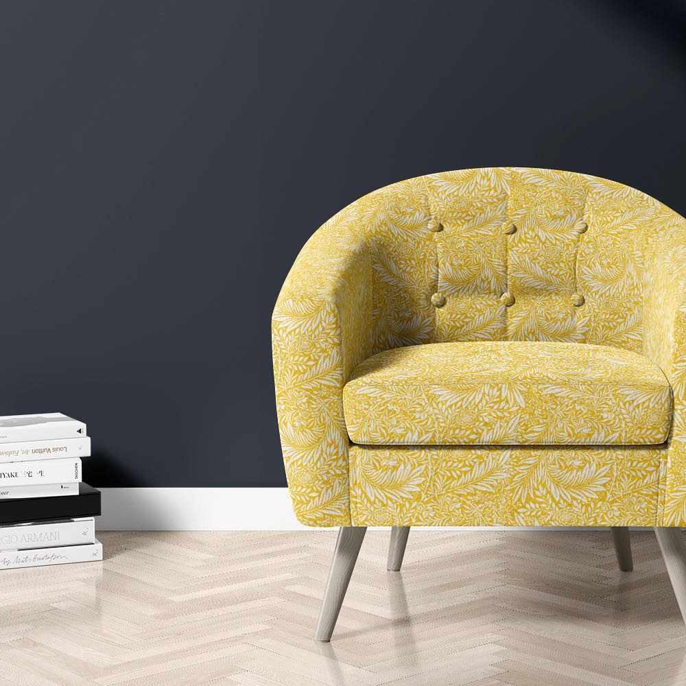 Chair upholstered in Honey Ochre Harlestone velvet – yellow leaf print fabric