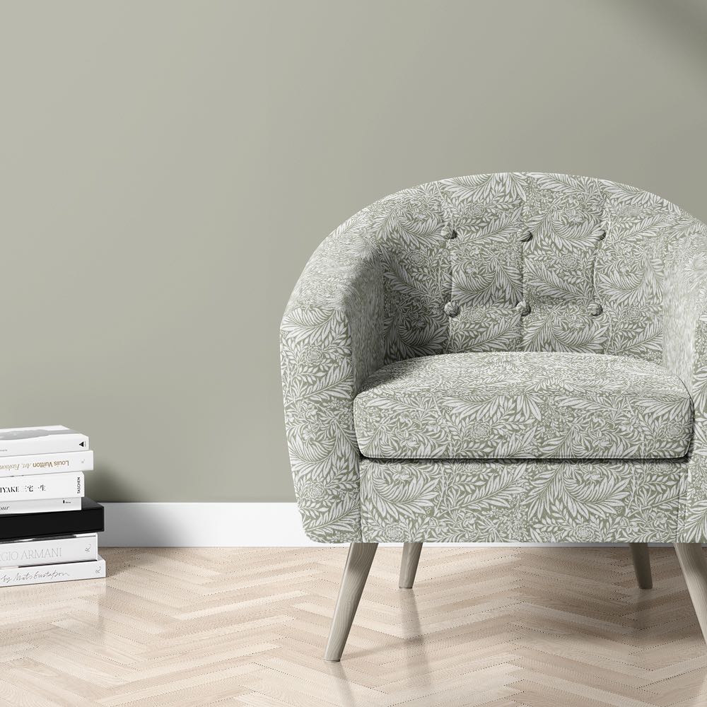 Chair upholstered in Harlestone Laurel Green velvet – leafy printed upholstery fabric