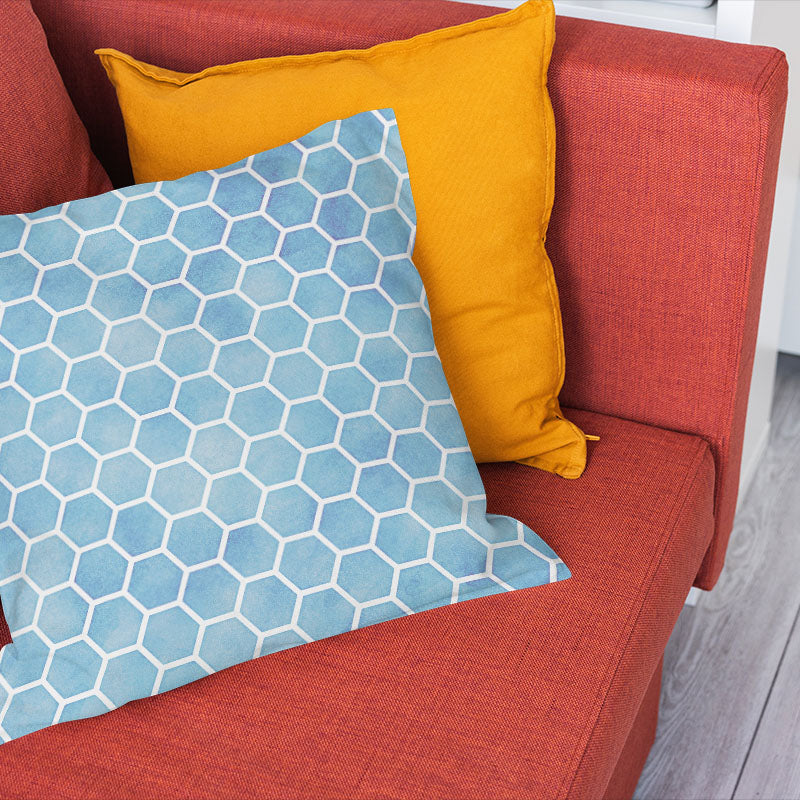 Sky blue washable curtain fabric shown on a cushion with modern honeycomb pattern