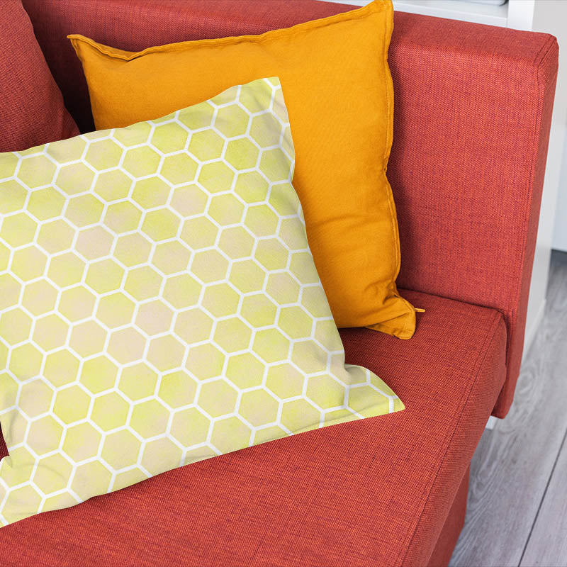 Yellow honeycomb fabric cushion bringing warm geometric colour to a modern room