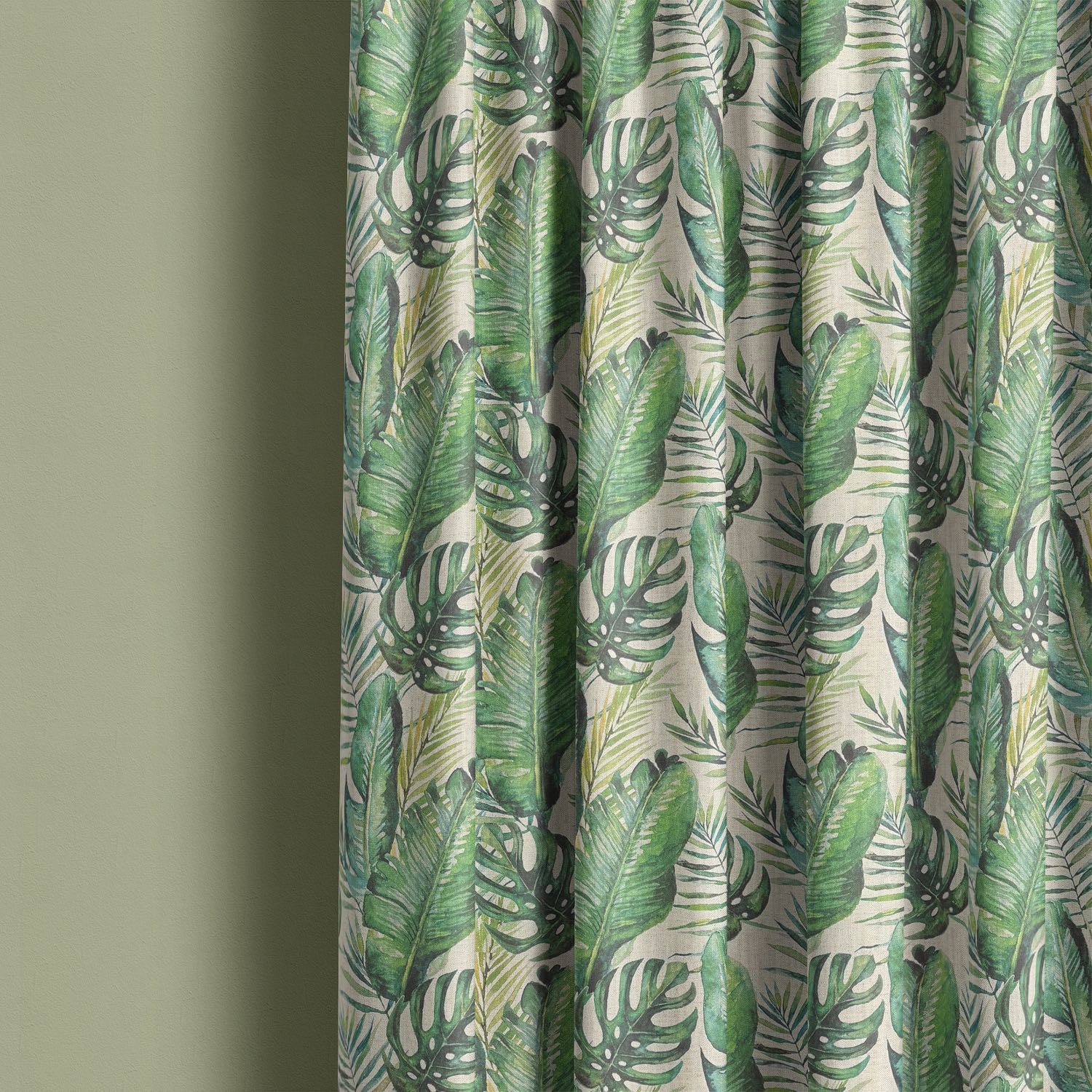 Curtain made with natural jungle leaf linen fabric, showing off vibrant green leaf motifs.