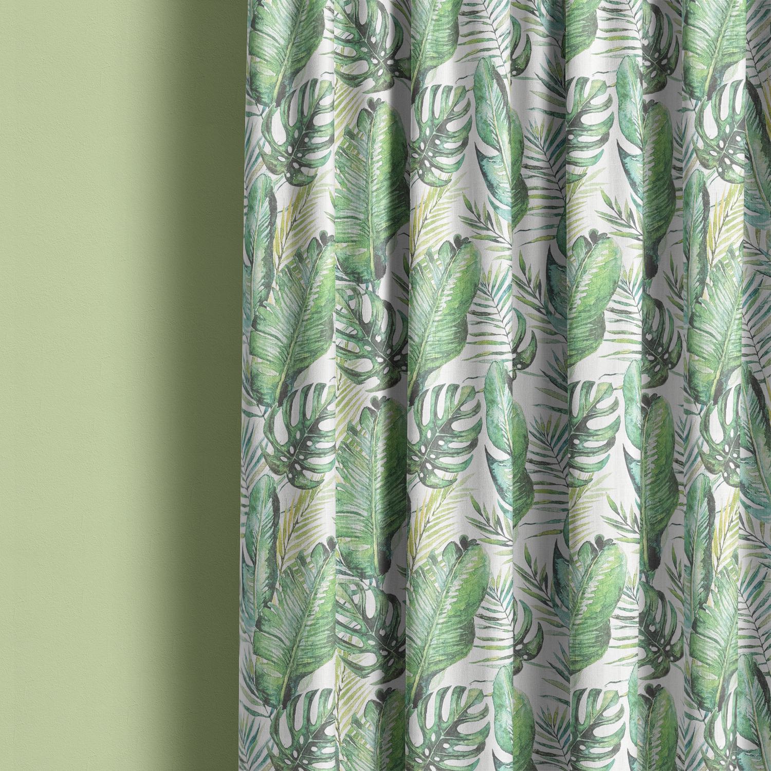 Linen curtain made from white jungle leaf fabric with green tropical foliage pattern.
