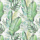 White jungle leaf linen curtain fabric featuring green monstera and banana leaves in a botanical print.