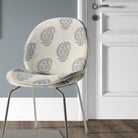 Kaveri Paisley Navy upholstery fabric used on a chair, adding a bold yet sophisticated touch to upholstery projects