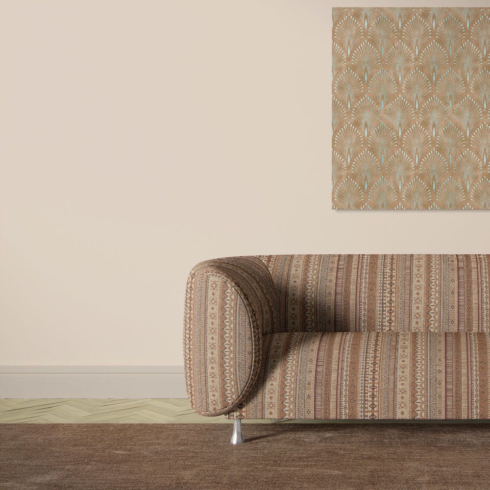 Khenifra Terracotta velvet upholstery fabric shown on a sofa with warm vertical stripe pattern