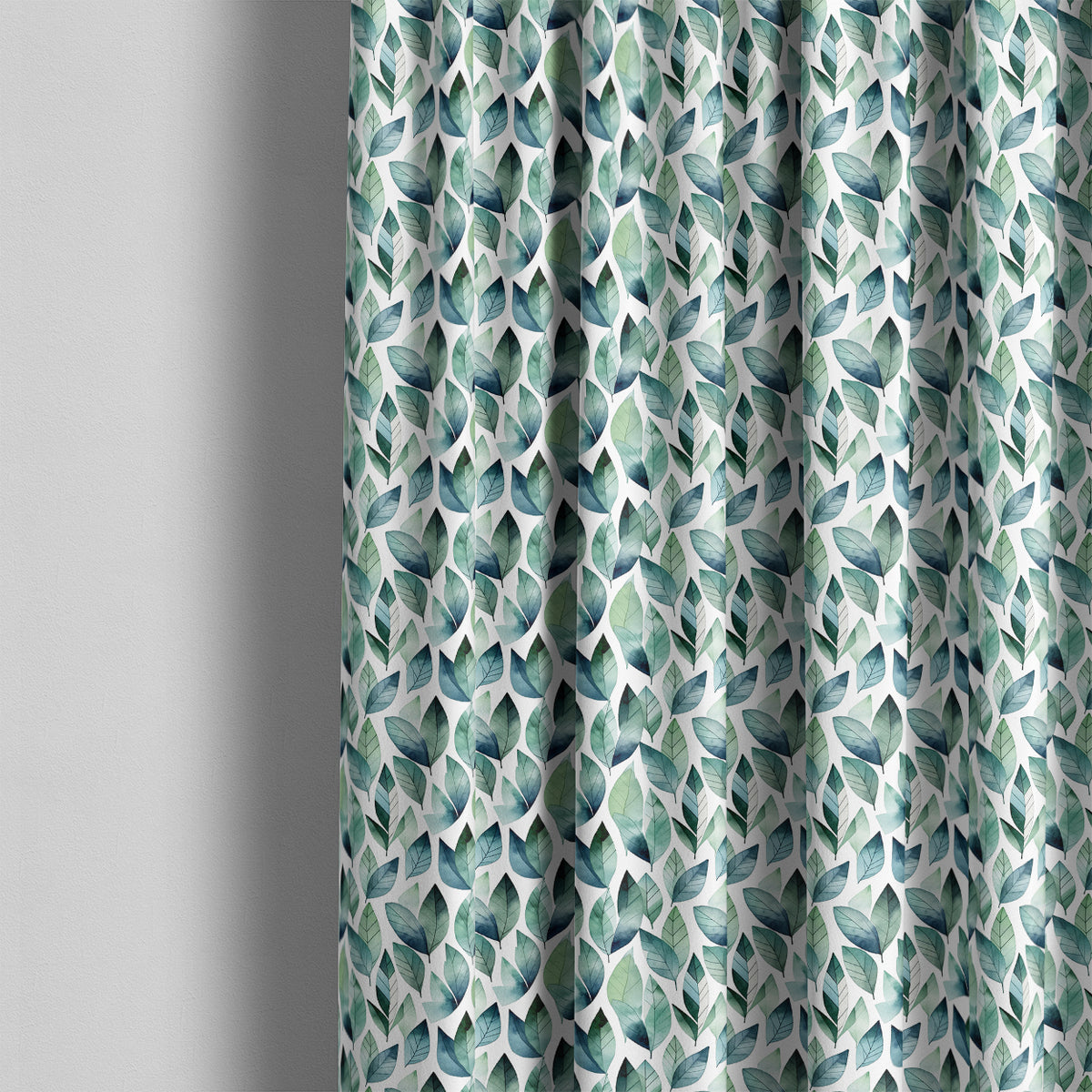 Kielder washable botanical fabric displayed as blue-green leaf print curtains in a light interior