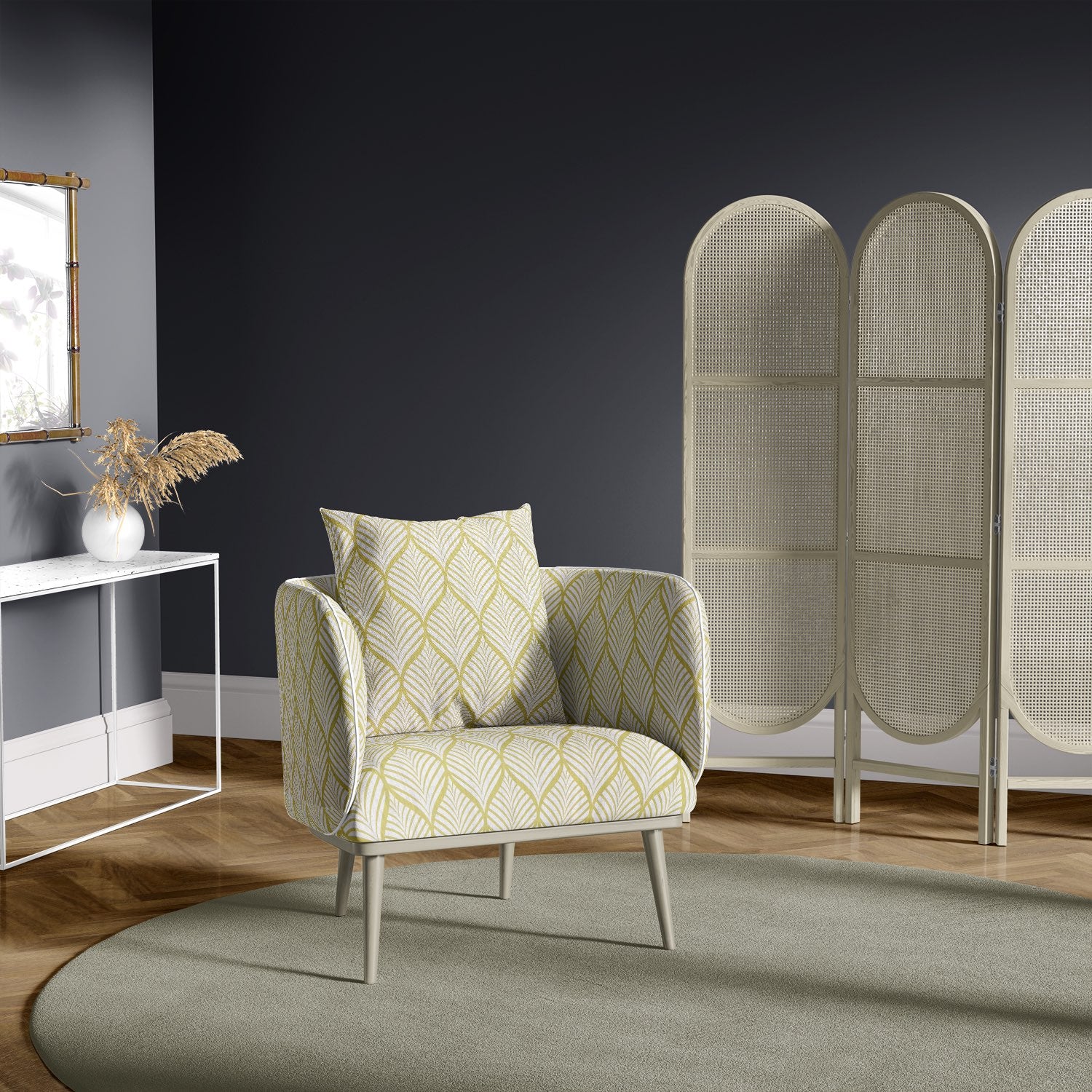 Lambourne Ochre leaf print upholstery fabric on an upholstered armchair