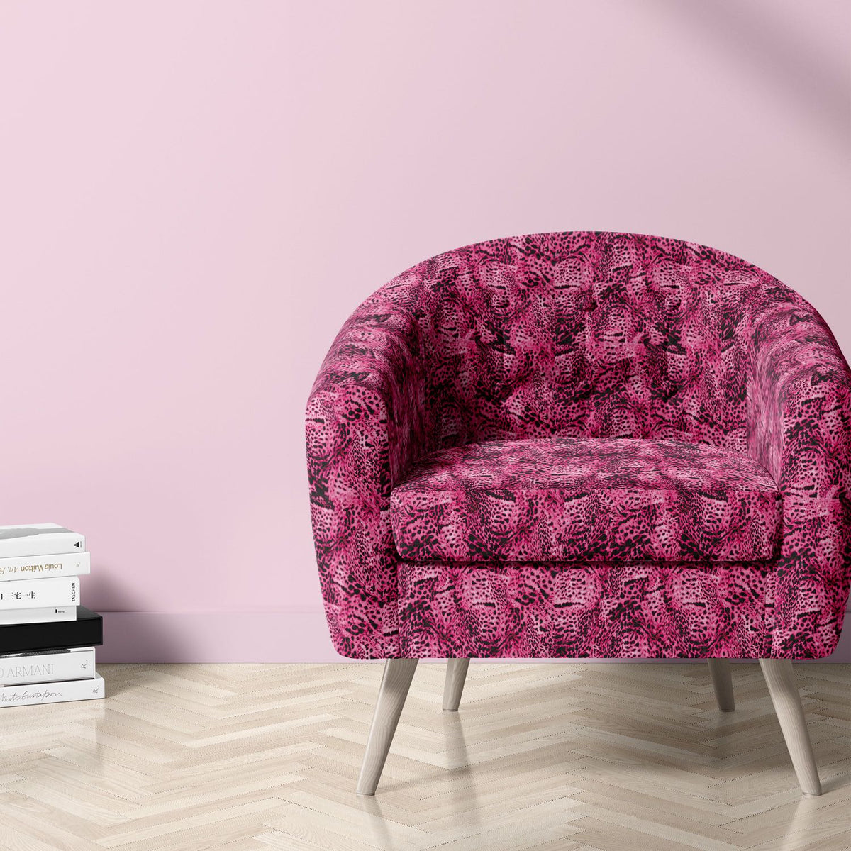 Pink leopard print velvet upholstery fabric on a statement chair in a blush interior