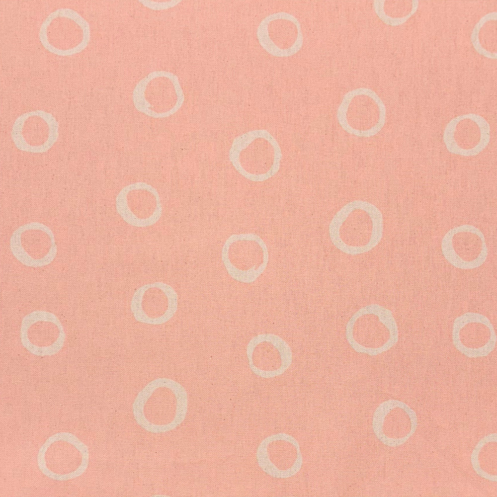 Limentra Blush Spotted Curtain Fabric – a soft pink polka dot fabric ideal for elegant window dressings.