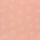 Limentra Blush Spotted Curtain Fabric – a soft pink polka dot fabric ideal for elegant window dressings.