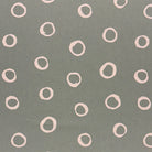 Limentra Fennel Spotted Curtain Fabric – a muted green polka dot fabric with a natural, organic feel.