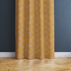 Limentra Ochre polka dot fabric – a vibrant yellow curtain fabric with a playful spotted pattern.