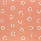 Limentra Peach Spotted Curtain Fabric – a soft orange polka dot fabric ideal for warm, inviting décor.