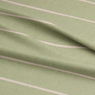 High-resolution close-up of Loire lemongrass striped upholstery fabric, showcasing its elegant striped pattern.