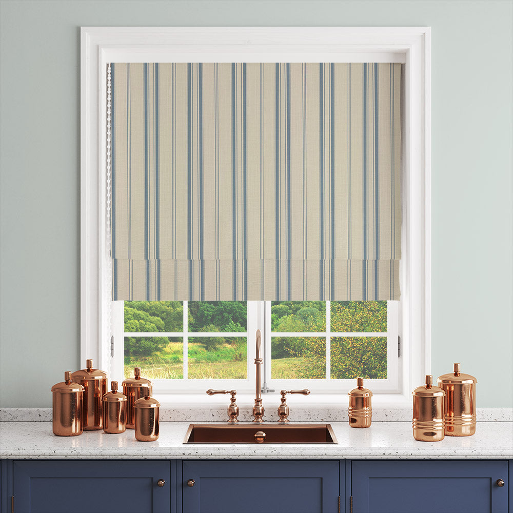 Lowick Stripe blue curtain fabric shown as a Roman blind in a bright interior