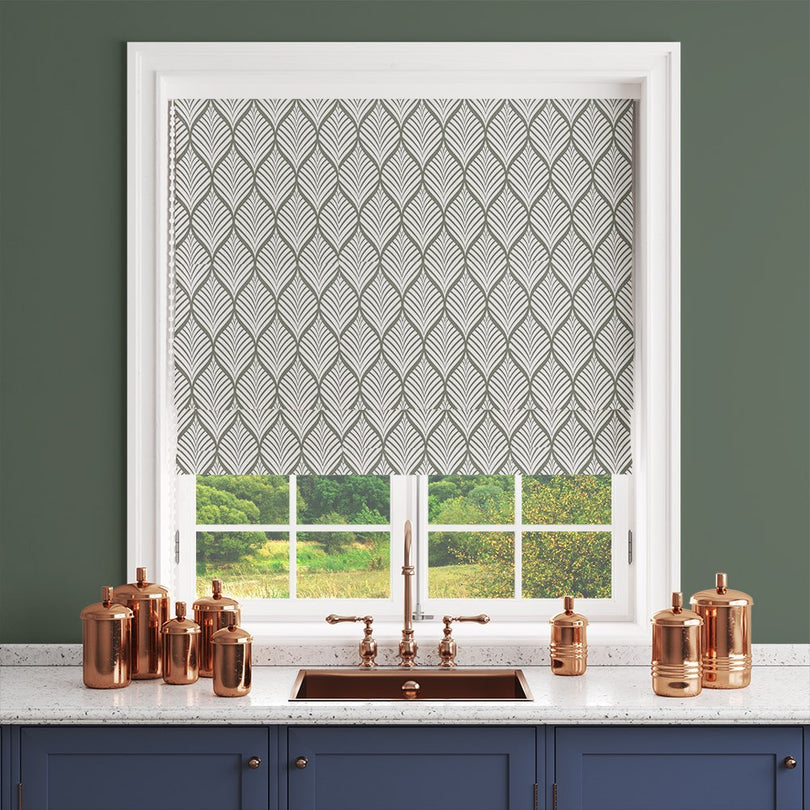 Marlow leaf pattern in Fennel on white background styled as a roller blind in a kitchen setting.