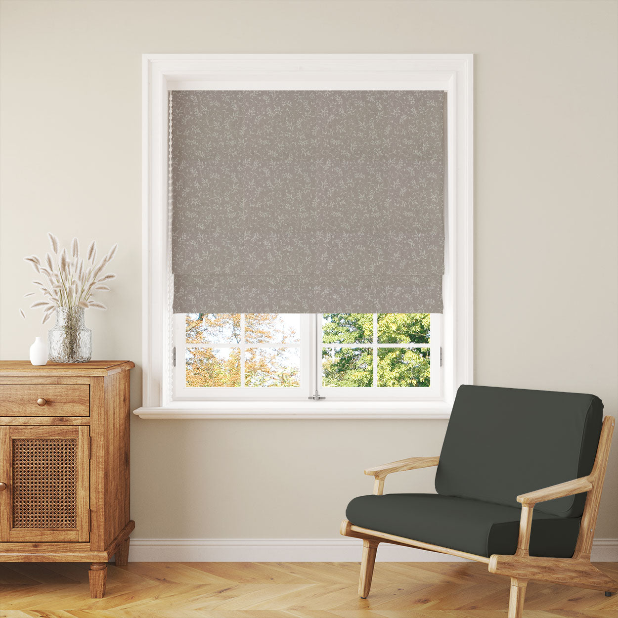 Milly Dusty Linen Roman blind showing neutral floral linen curtain fabric in a room