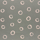 Fennel green spotted polka dot upholstery fabric with a natural, earthy tone, ideal for adding depth to furniture.
