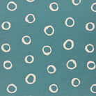 Teal spotted polka dot upholstery fabric with a bold, rich hue, perfect for adding a striking touch to furniture.