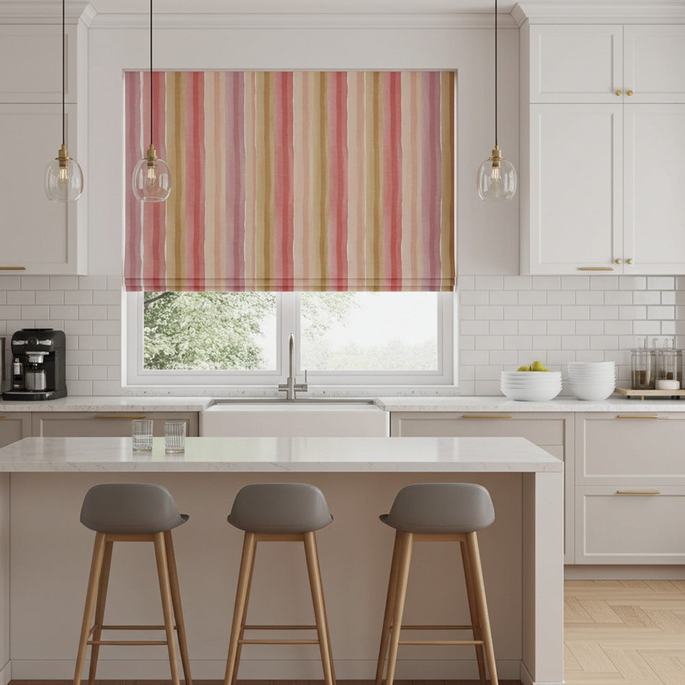 Multicoloured striped blind fabric in a contemporary white kitchen with island seating and pendant lights