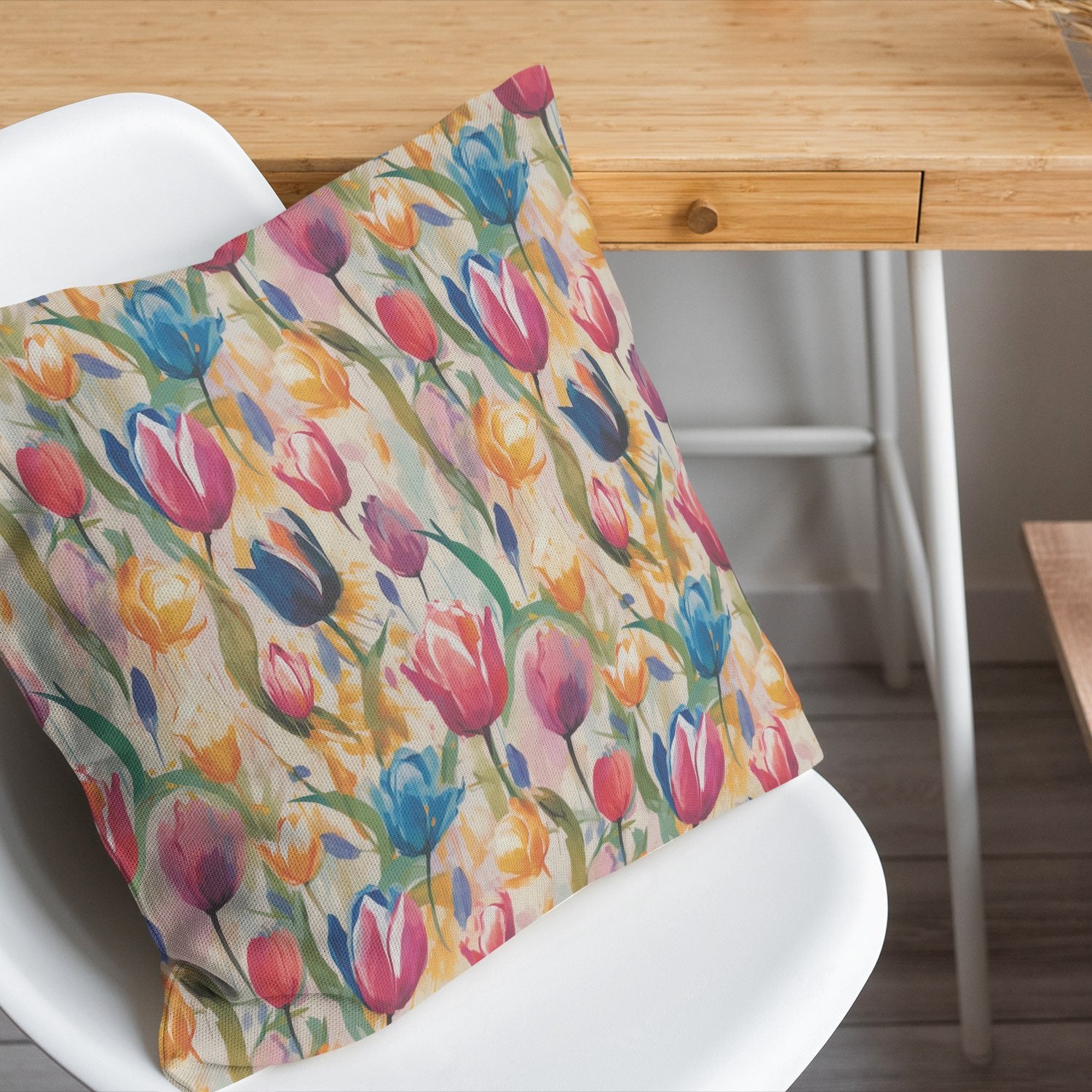 Pastel Tulips multicoloured cotton fabric made into decorative cushion on chair