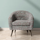 Penrose Floral Duck Egg upholstery fabric on armchair with blue-toned floral pattern