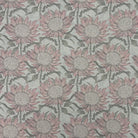 Flat lay of Penrose Floral Duck Egg upholstery fabric with soft blue and pink flowers