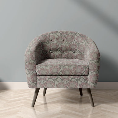 Penrose Floral Mist upholstery fabric on chair with muted pink and grey flower design