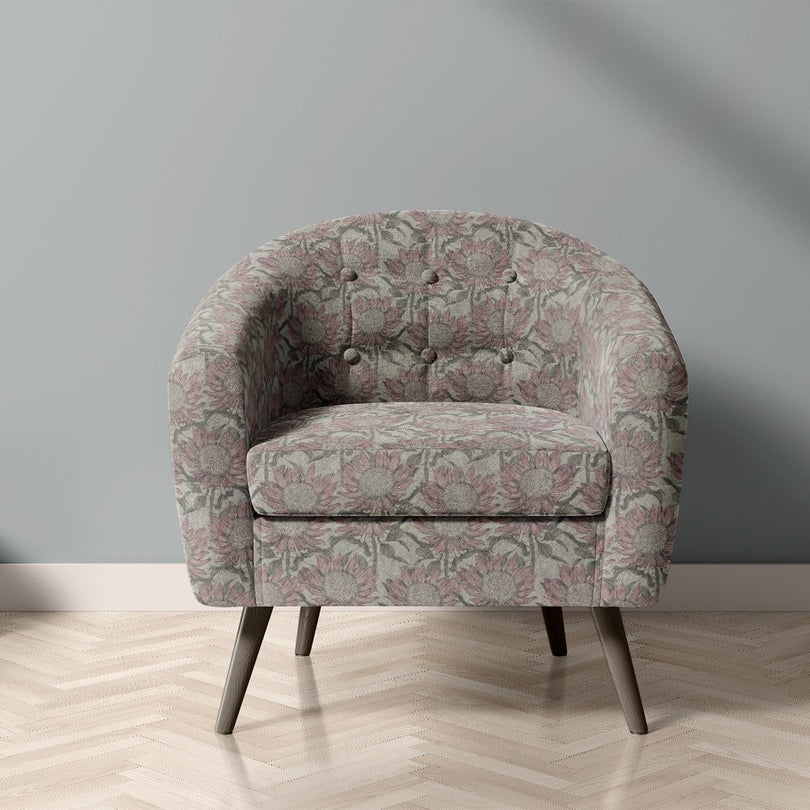 Penrose Floral Mist upholstery fabric on chair with muted pink and grey flower design