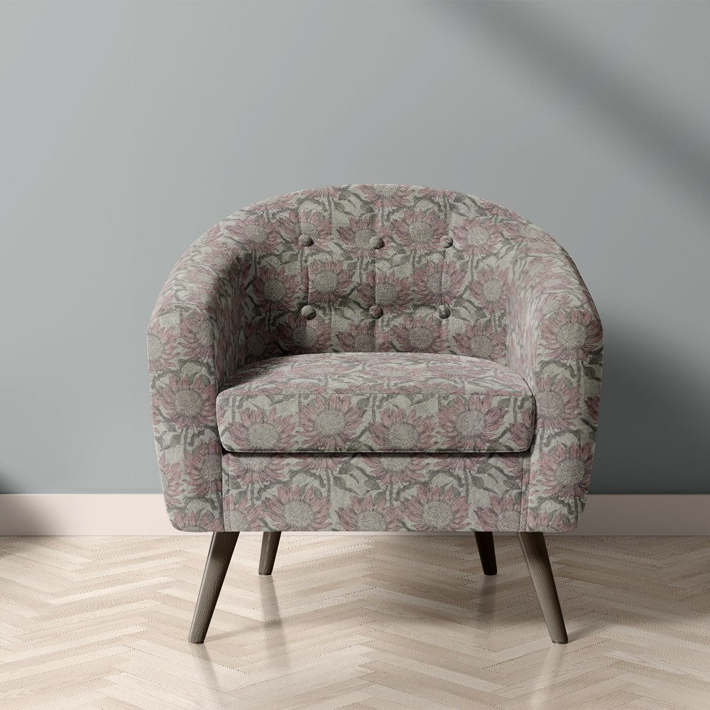 Penrose Floral Mist upholstery fabric on chair with muted pink and grey flower design