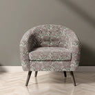 Penrose Floral Natural upholstery fabric on accent chair with pink flower pattern