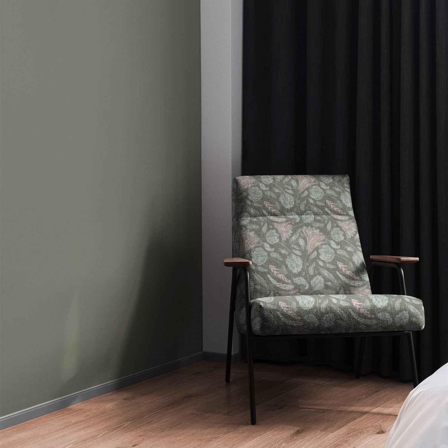 Armchair upholstered in Porthgain Green floral upholstery fabric