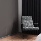 Armchair styled in Porthgain Navy floral upholstery fabric with bold pattern