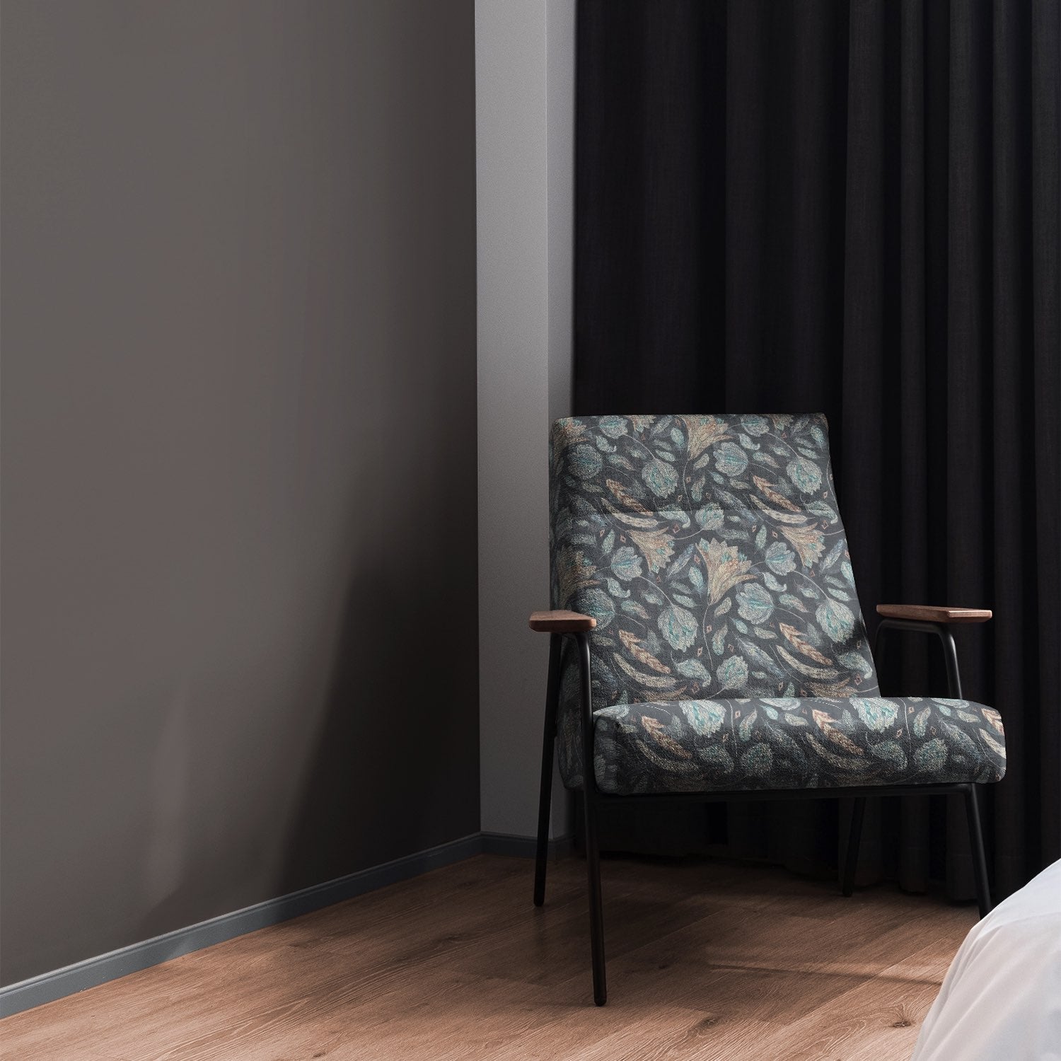 Armchair styled in Porthgain Navy floral upholstery fabric with bold pattern