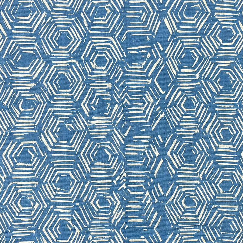 Blue geometric curtain fabric with hexagon print shown flat