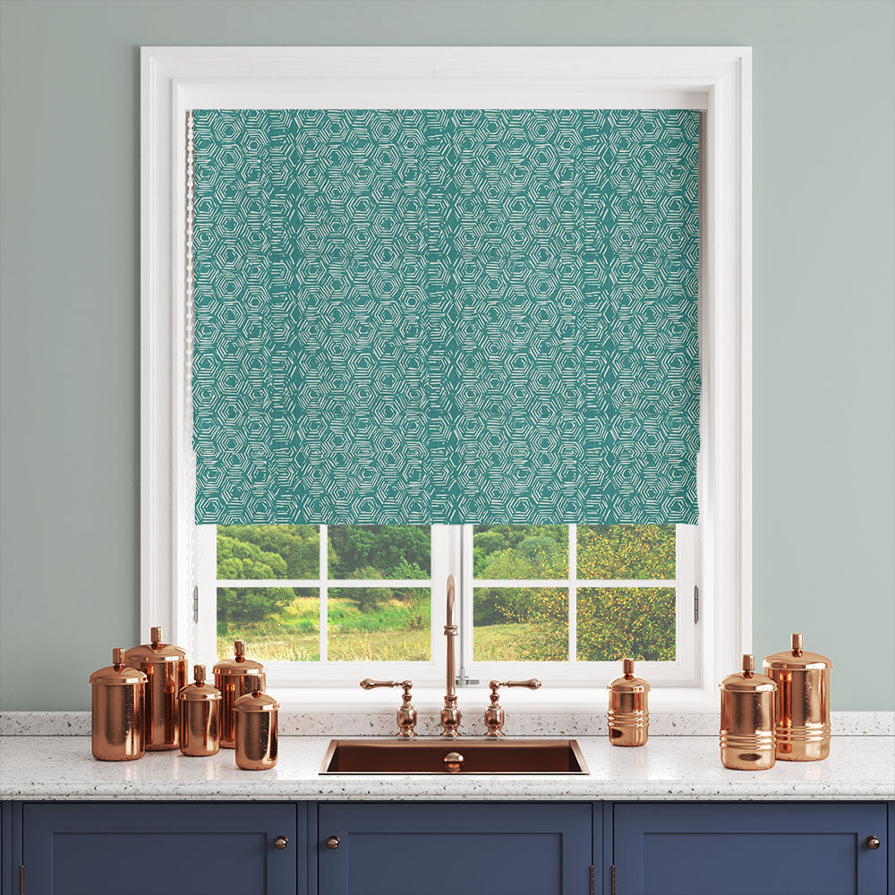 Teal geometric curtain fabric styled as a blind in a kitchen setting