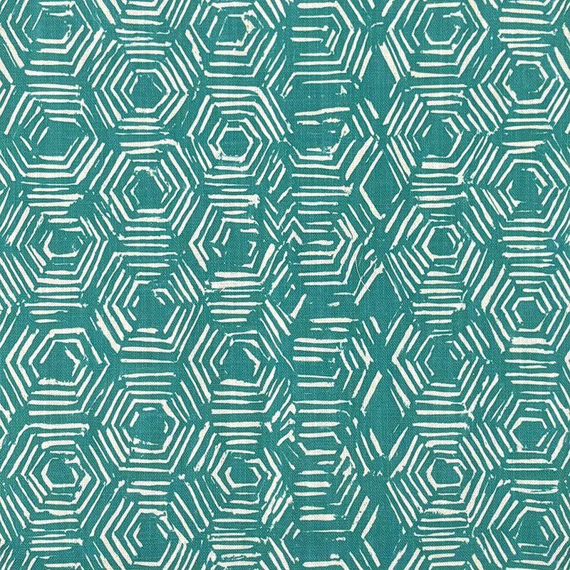 Flatlay image of teal geometric curtain fabric with modern hexagonal print