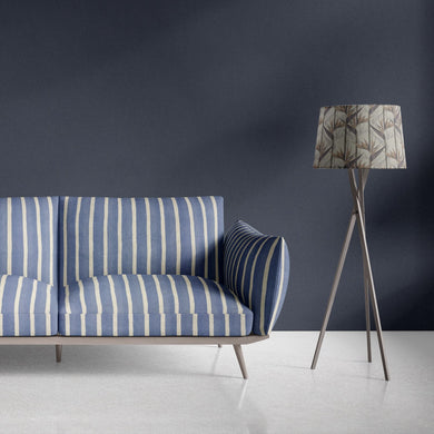 Blue striped upholstery fabric on modern sofa with cream vertical lines
