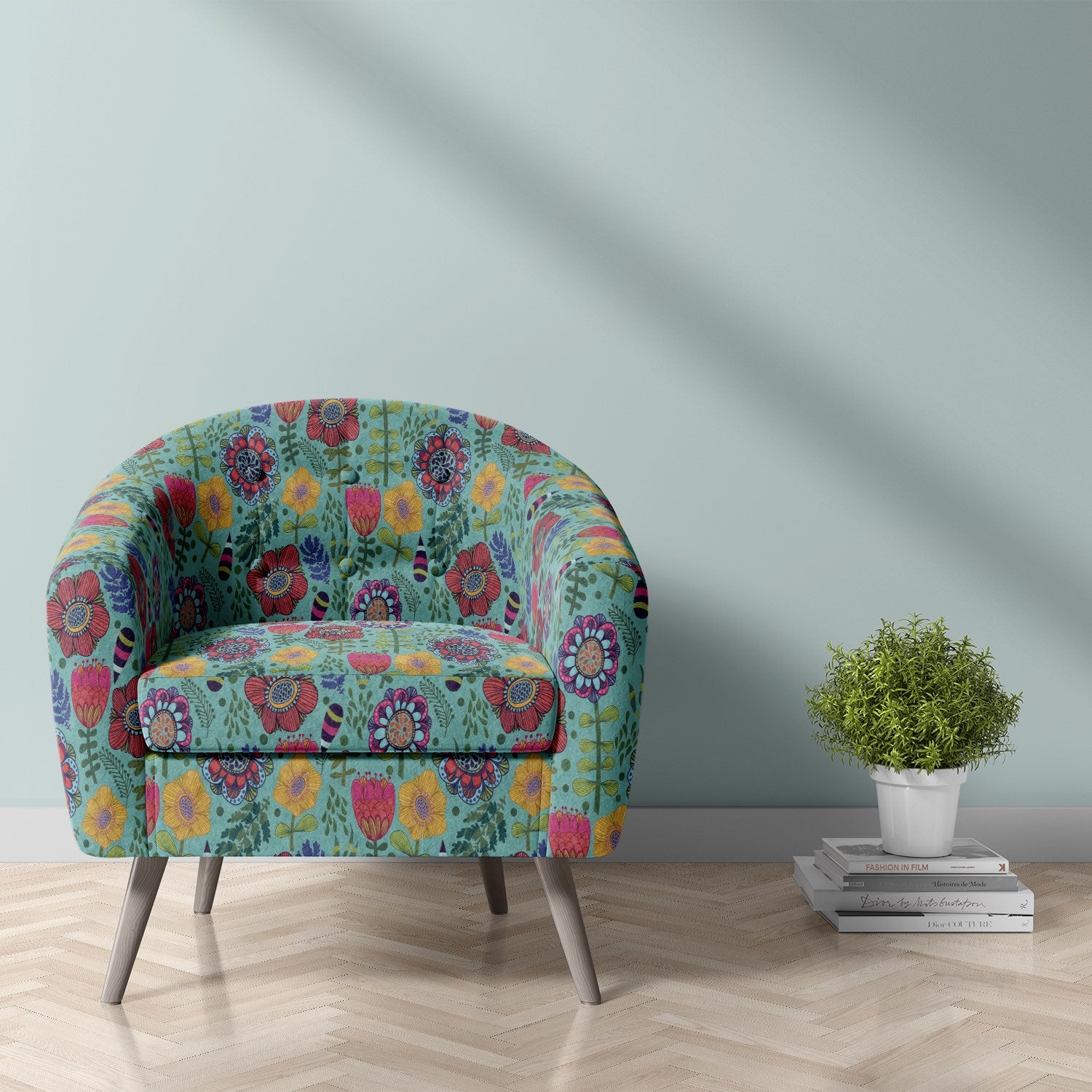 Barrel chair upholstered in teal Rosemaling velvet fabric with folk-inspired floral pattern