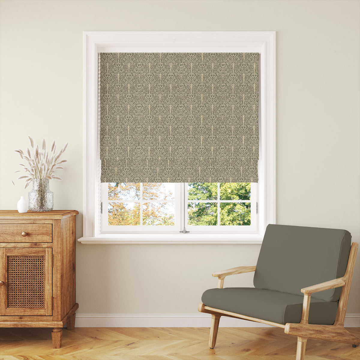 Rowan Leaf Olive patterned Roman blind styled with warm wood and relaxed country interiors