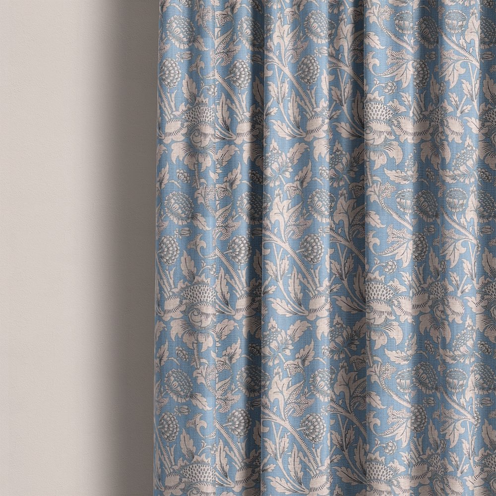 Floral curtain fabric in soft blue with intricate botanical detailing, perfect for classic and elegant interiors.