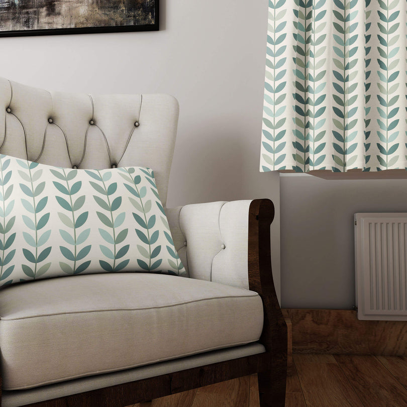 Scandi Stem Duck Egg linen curtain fabric styled on a cushion and curtain in a modern living room