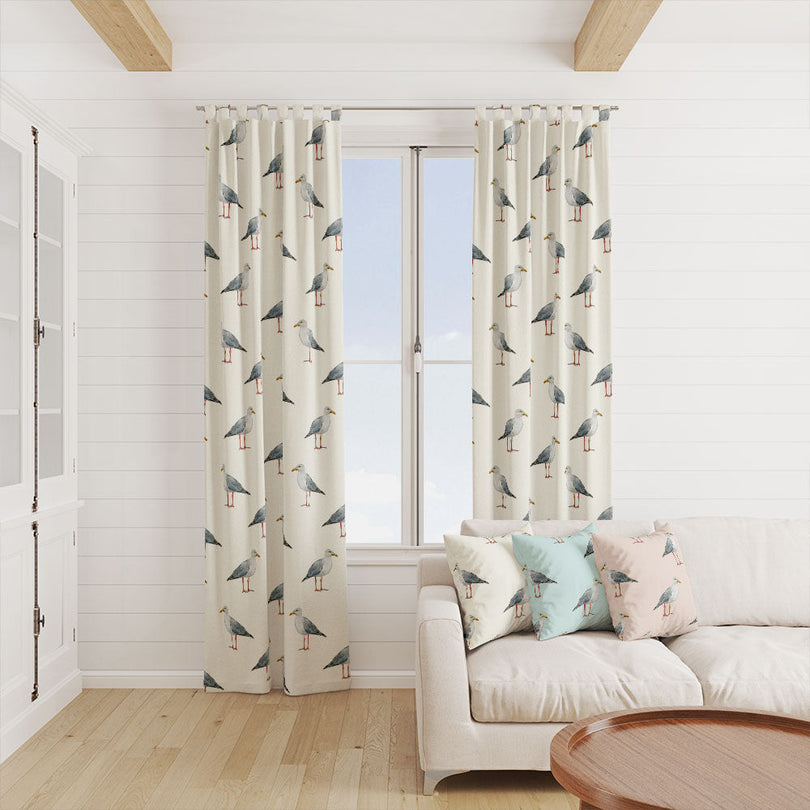 Seagulls Cotton Curtain Fabric - Ivory draping gracefully in a beach house bedroom