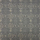 Solstace Golden Noir Upholstery Fabric flat fabric sample with gold geometric motif