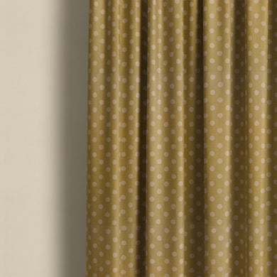 Ochre spot curtain fabric with playful polka dot design, ideal for modern living room or bedroom curtains