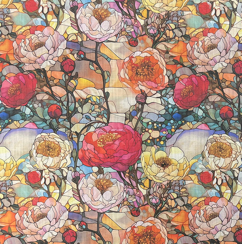 Beautiful stained glass fabric featuring vibrant colors and intricate patterns for use in quilting and home decor projects