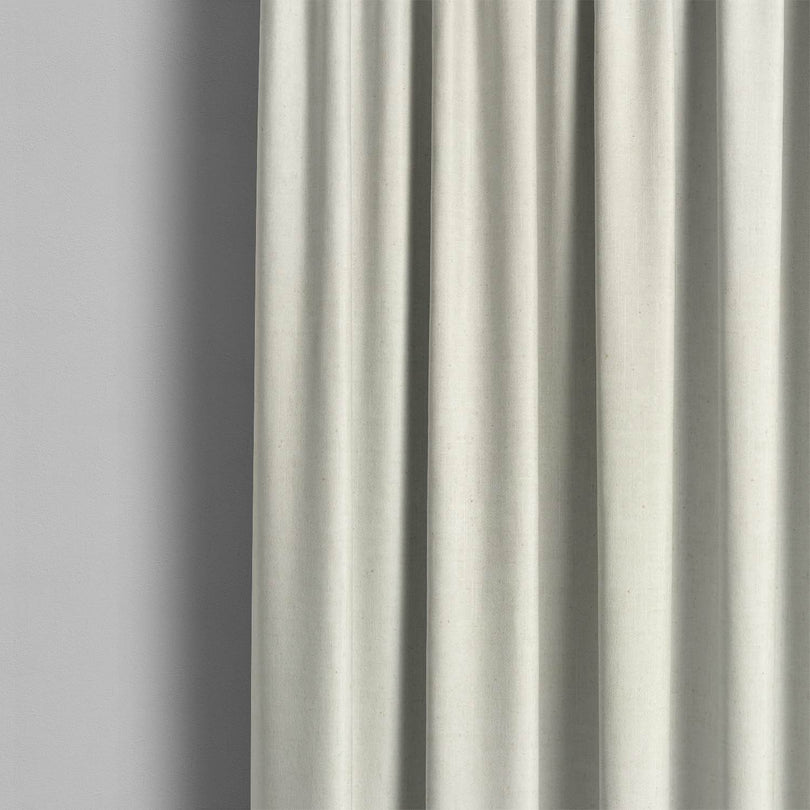 A room setting with the Stow Linen Curtain Fabric, adding a touch of elegance to the space
