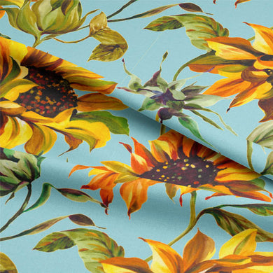 Beautiful sunflower patterned cotton fabric in azure blue for curtains