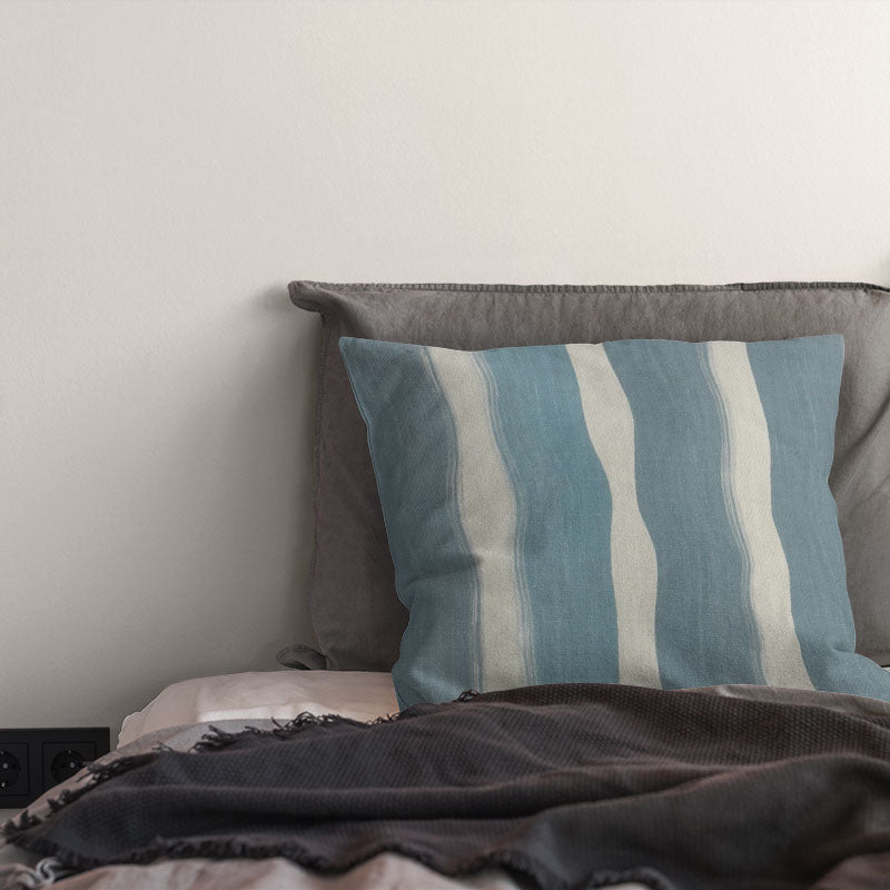 striped curtain fabric cushion in soft ice blue tones with painterly vertical stripe design on linen blend fabric