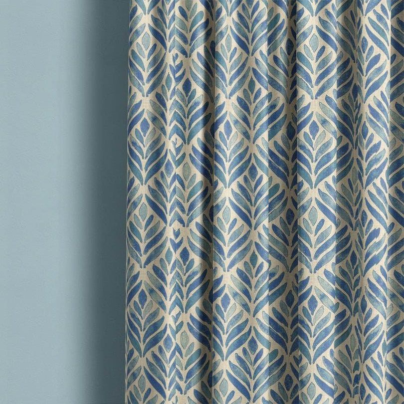 A close-up image of watercolour leaves upholstery fabric in shades of green and blue, perfect for adding a natural and artistic touch to any furniture or home decor project